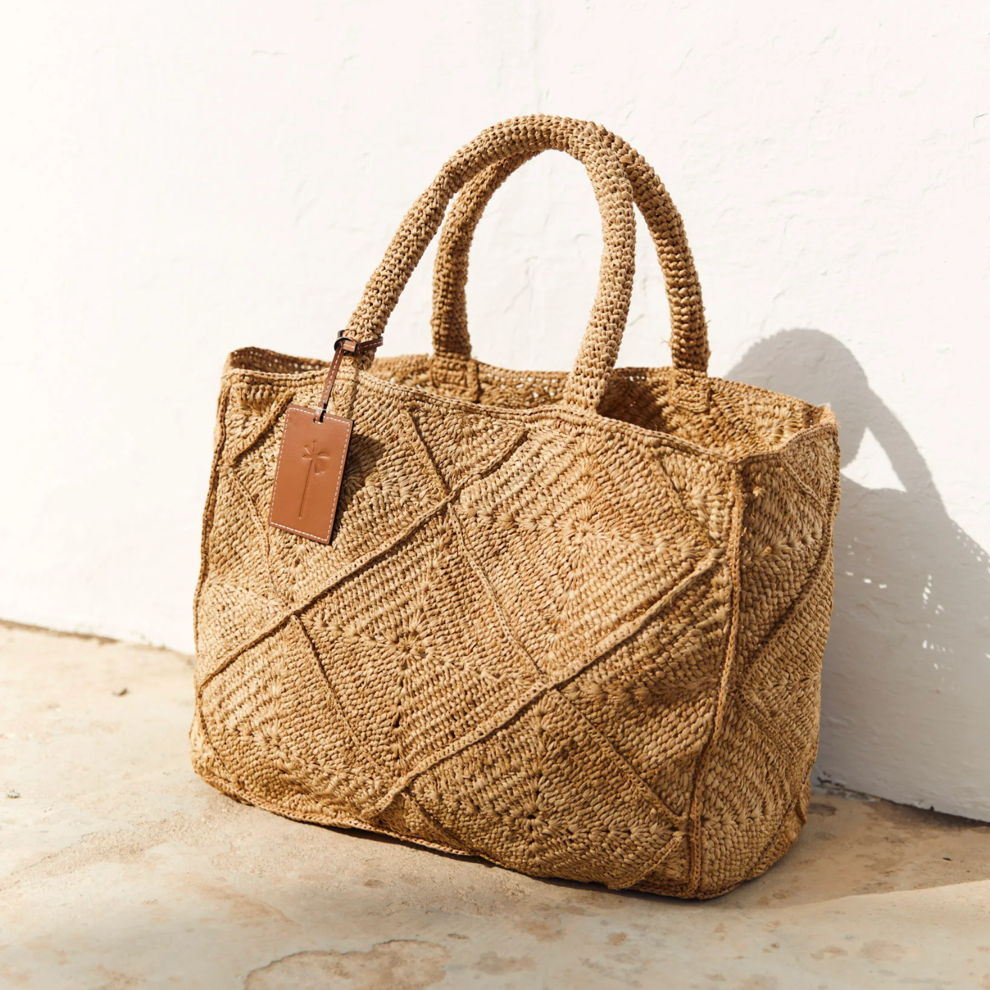 manebi large tan raffia sunset bag