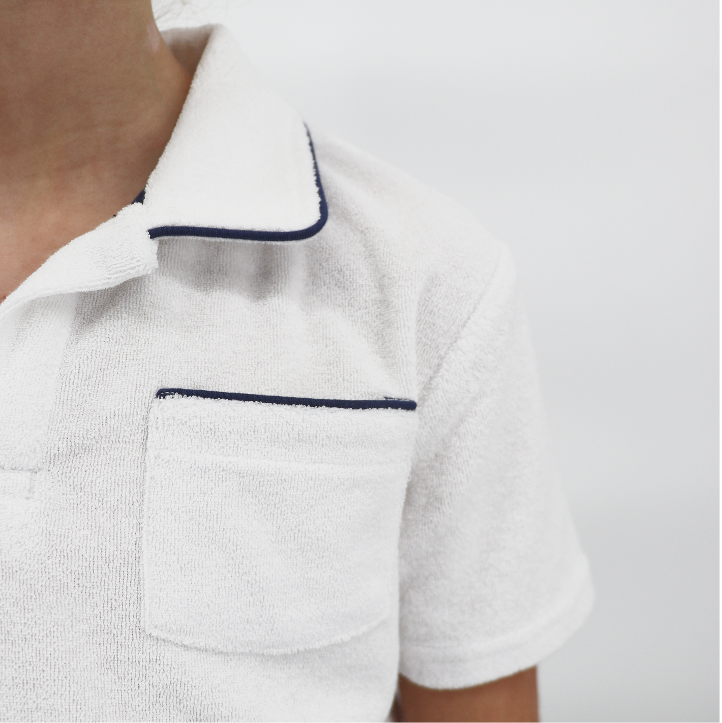 unisex white french terry polo with navy piping