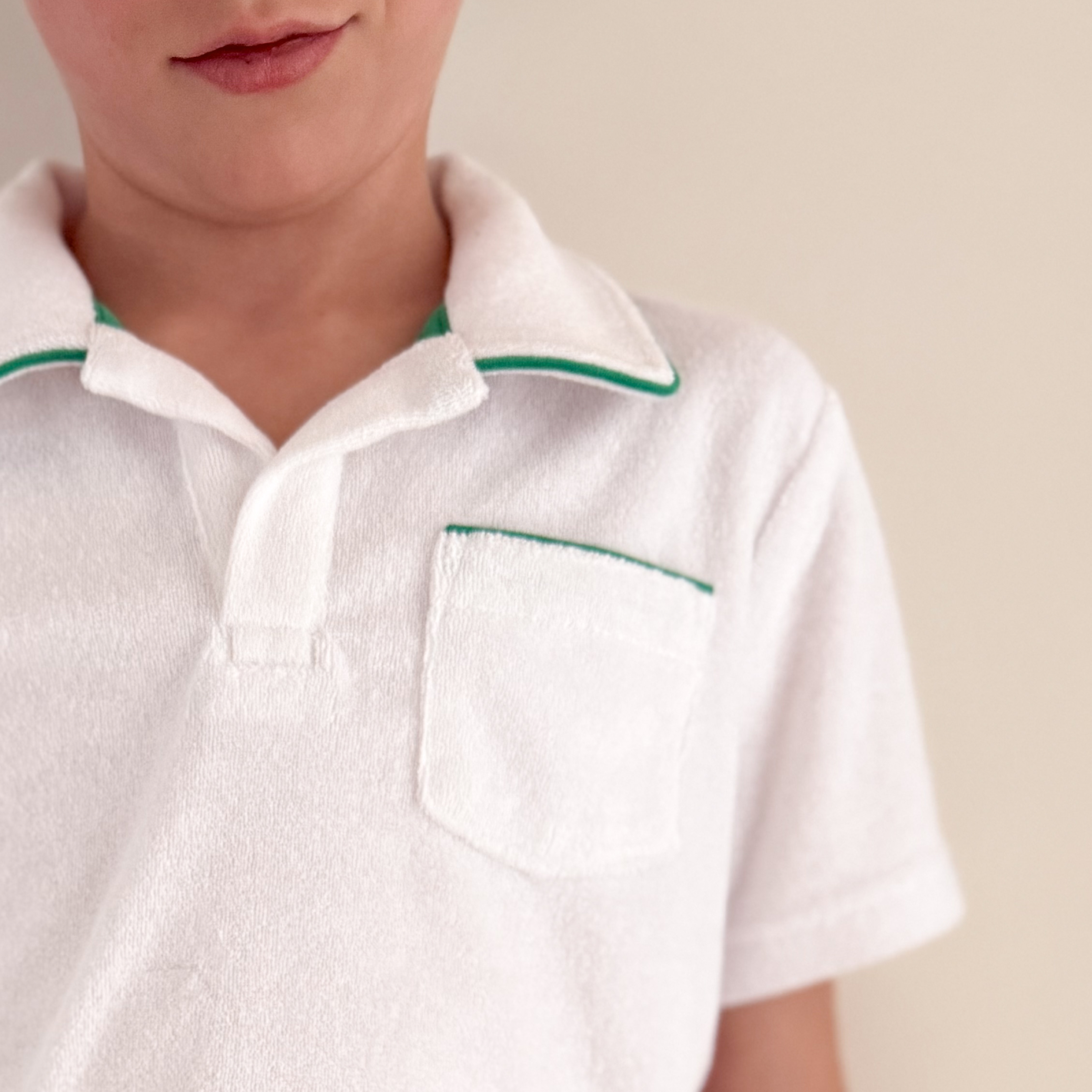 boys white french terry polo with bermuda green trim