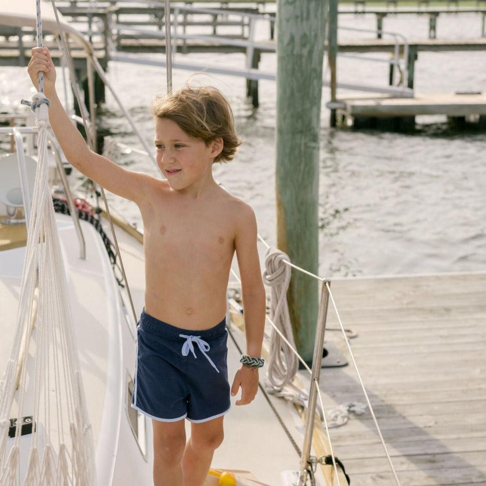 boys navy boardie with side binding